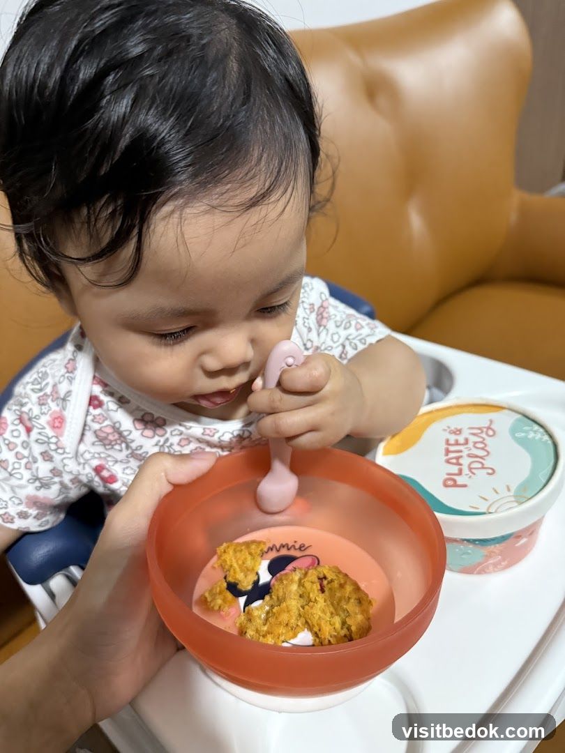 Baby eating from a bowl