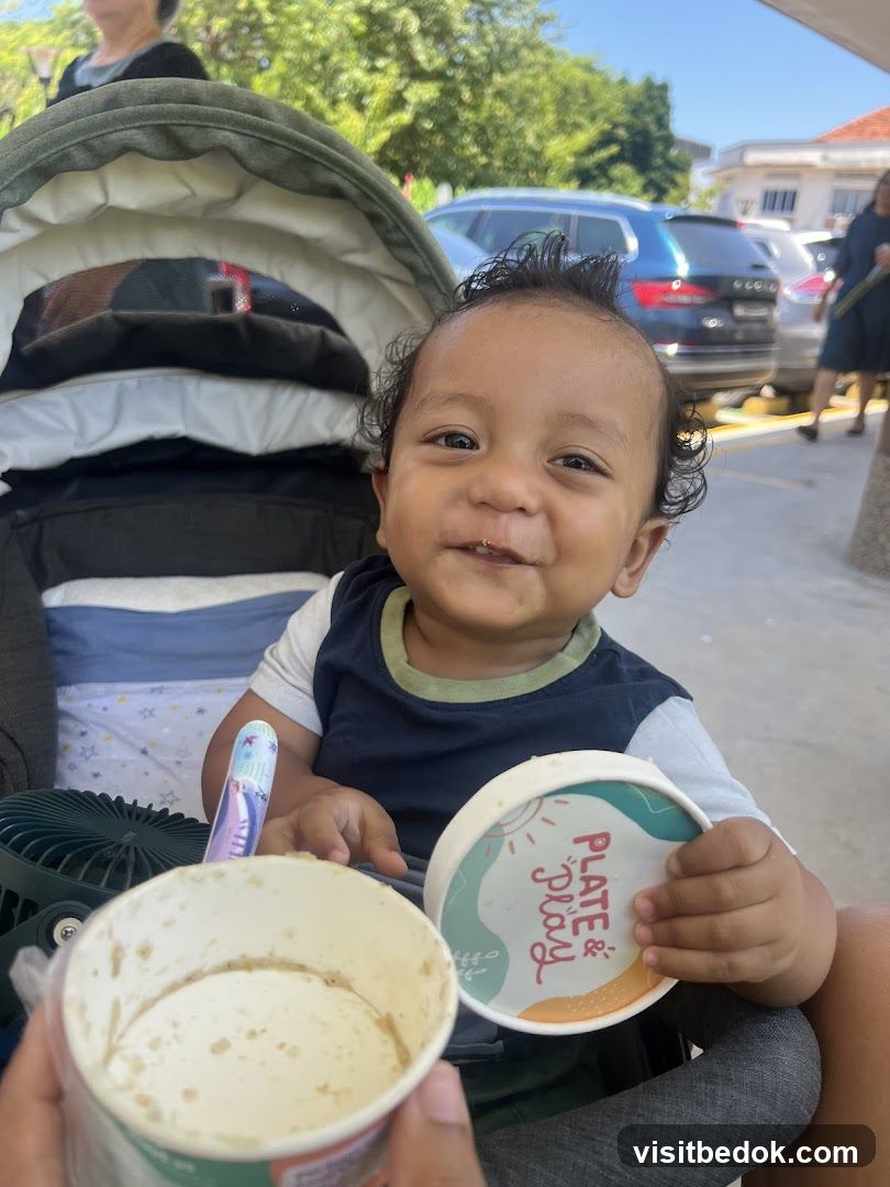 Baby with food containers