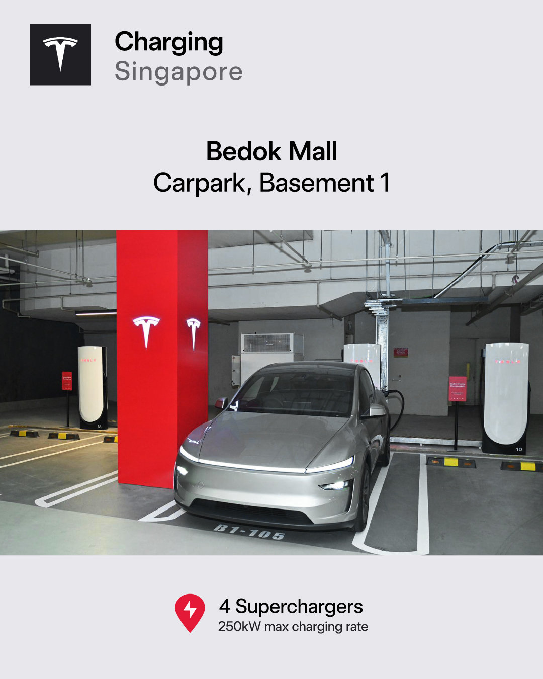 Silver Tesla charging at Bedok Mall Basement 1 Superchargers, stall B1-105, with a red Tesla column and 250 kW stalls